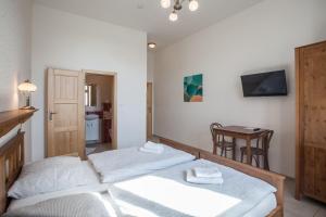Postel nebo postele na pokoji v ubytování Penzion a restaurace U Hájků