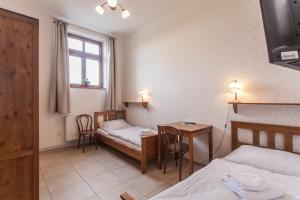 Postel nebo postele na pokoji v ubytování Penzion a restaurace U Hájků
