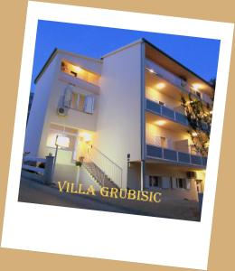 a white building with the words villa critique at Villa Marin- MAKARSKA in Makarska