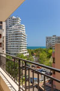 a balcony with a view of a city and buildings at Apartments Flora 1 in Burgas