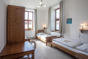 Postel nebo postele na pokoji v ubytování Penzion a restaurace U Hájků