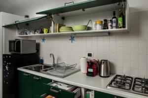 A kitchen or kitchenette at La Magnolia, Caressa de mä