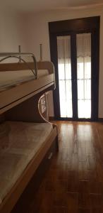 A bed or beds in a room at Casita de Rosario
