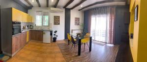 a kitchen with a table and a dining room at Trakia Street Apartment in Plovdiv