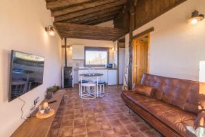A seating area at El BURGO DE OSMA ALOJAMIENTO RURAL VILLA BAGH