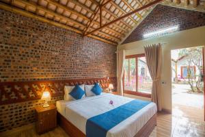 Ένα ή περισσότερα κρεβάτια σε δωμάτιο στο Tam Coc Serene Bungalow
