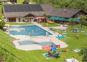a group of people swimming in a swimming pool at Ferienhaus Bergwelt in Liesing