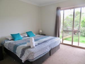 Ένα ή περισσότερα κρεβάτια σε δωμάτιο στο Ocean View Beach House, Margaret River