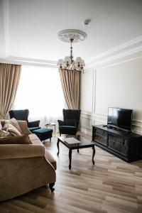a living room with a couch and a table at Old Town River Apartments in Klaipėda