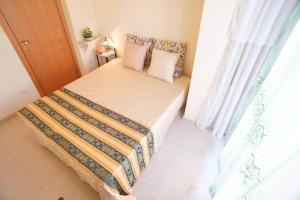 Postel nebo postele na pokoji v ubytování vacanza Taormina mare