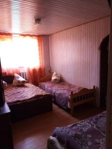 Ein Bett oder Betten in einem Zimmer der Unterkunft Rukavychka