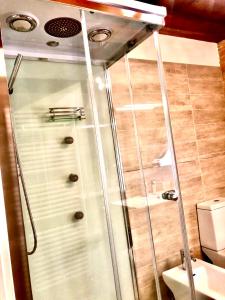 a shower with a glass door in a bathroom at B&B la Serenissima in Fossalta di Portogruaro