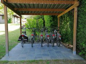 
a row of bikes parked next to each other at Studio's Park - Heverlee in Leuven
