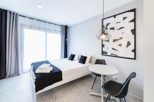 Posteľ alebo postele v izbe v ubytovaní Odra View Apartments III