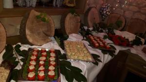 a table with many different types of desserts on it at Hotel Heiderhof in Obersteinebach