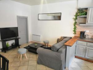 a living room with a couch and a table at La Casa de Brens in Brens