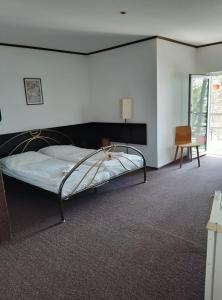 
Postel nebo postele na pokoji v ubytování Hotel Na Pláži

