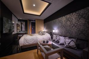 Postel nebo postele na pokoji v ubytování HOTEL C.KOHOKU