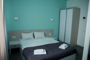 Postel nebo postele na pokoji v ubytování Volna Hotel