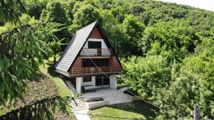 a small house in the middle of a forest at Apartment Stanic in Šipovo