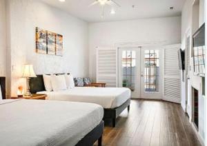 a large bedroom with two beds and a fireplace at Amira Vacation Resort in St. George +24 photos