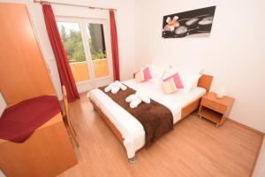 Posteľ alebo postele v izbe v ubytovaní Apartments Ćurković (Orebić - Dalmatia)