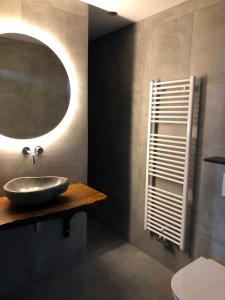 a bathroom with a sink and a mirror at The Rock in Zandvoort +25 photos