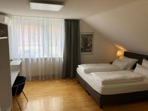 Postel nebo postele na pokoji v ubytování City Apartments FN L7 KLIMATISIERT-mit Küche