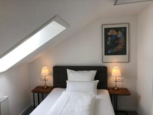 Postel nebo postele na pokoji v ubytování City Apartments FN L7 KLIMATISIERT-mit Küche