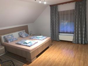 Ένα ή περισσότερα κρεβάτια σε δωμάτιο στο Apartman Patrik