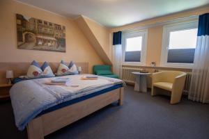 Hotel Norden Norddeich tesisinde bir odada yatak veya yataklar