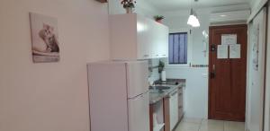 A kitchen or kitchenette at Sweet House