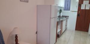 A kitchen or kitchenette at Sweet House