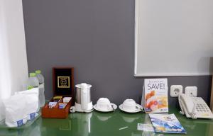 a counter top with some items on top of it at Ara Inn Bed And Breakfast by ecommerceloka in Kuta