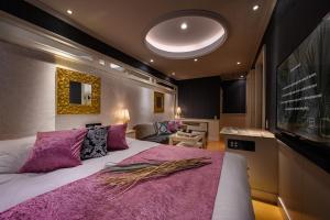 Postel nebo postele na pokoji v ubytování HOTEL C.KOHOKU