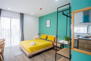 Postel nebo postele na pokoji v ubytování Nami Home Da Nang