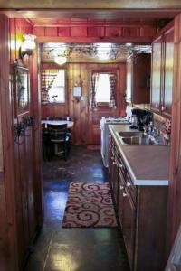 a kitchen with a sink and a counter top at Cabin #7 - Northwoods Retreat cabin in Carp Lake