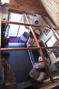 an overhead view of a spiral staircase in a house at Cabin #7 - Northwoods Retreat cabin in Carp Lake +16 photos