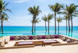 a view of the ocean from a resort infinity pool at Fusion Resort Cam Ranh - All Spa Inclusive in Cam Ranh