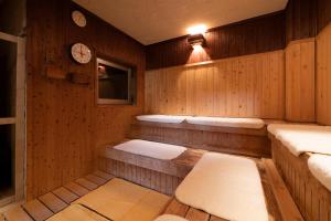 Postel nebo postele na pokoji v ubytování Hotel Monzennoyu