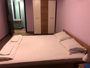 A bed or beds in a room at Anfid Apartments