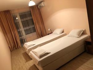 A bed or beds in a room at Anfid Apartments
