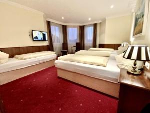 A bed or beds in a room at Villa Turnerwirt