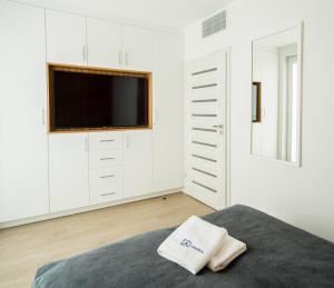Łóżko lub łóżka w pokoju w obiekcie Apartos Sailor - Luxury Apartments