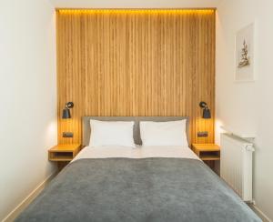 Łóżko lub łóżka w pokoju w obiekcie Apartos Sailor - Luxury Apartments