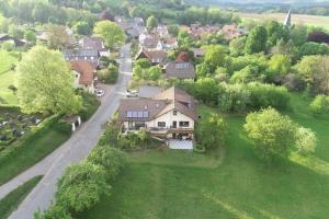 an aerial view of a house in a village at Müller's Ferienwohnungen in Rödental