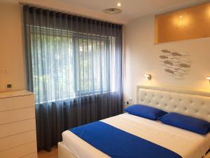 Postel nebo postele na pokoji v ubytování Blue Lagune Taormina Mare