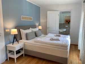Кровать или кровати в номере Landgut Mosch