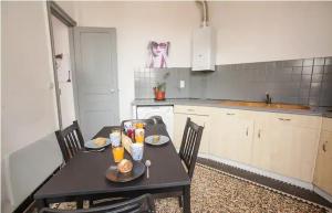 a kitchen with a table with food and drinks on it at Appartement charmant dans le centre de Biarritz Dan 3ème étage in Biarritz