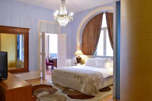 Postel nebo postele na pokoji v ubytování Palacete Chafariz Del Rei - by Unlock Hotels